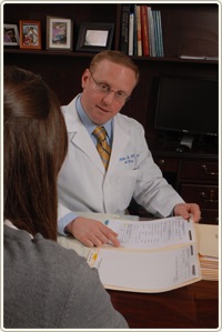 Dr. Fiore consulting with a patient